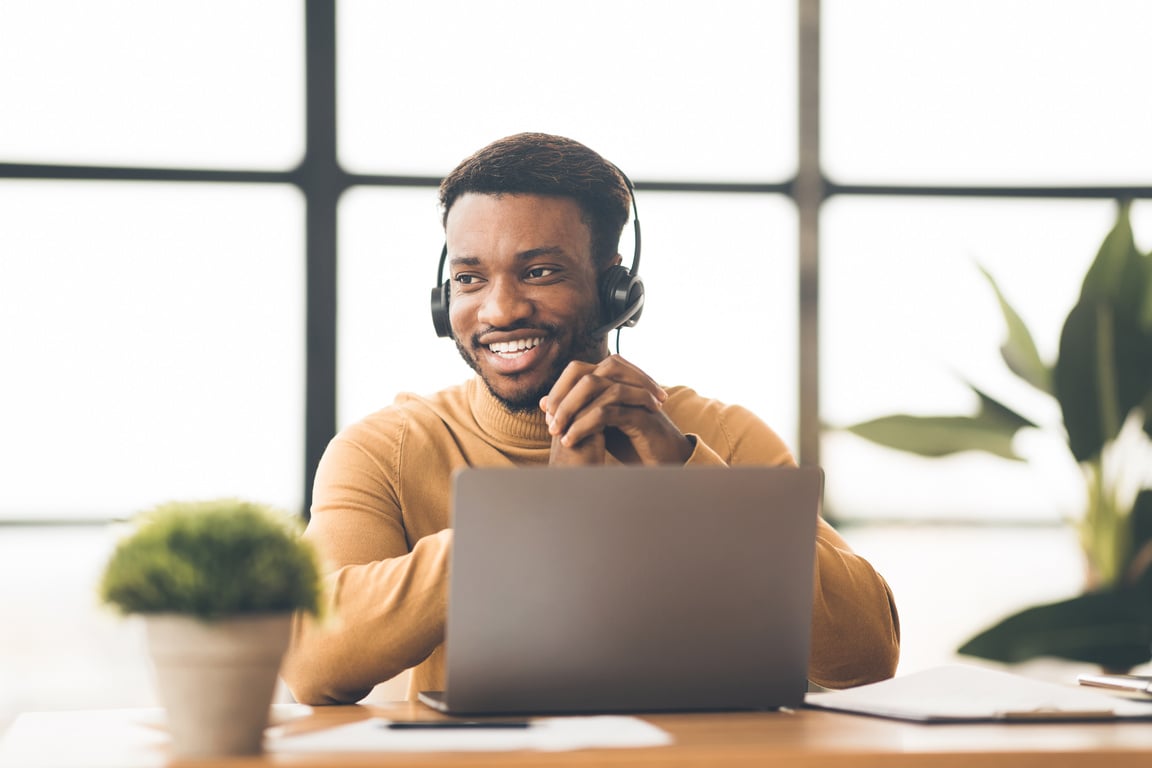 Happy Man Working in Call Center